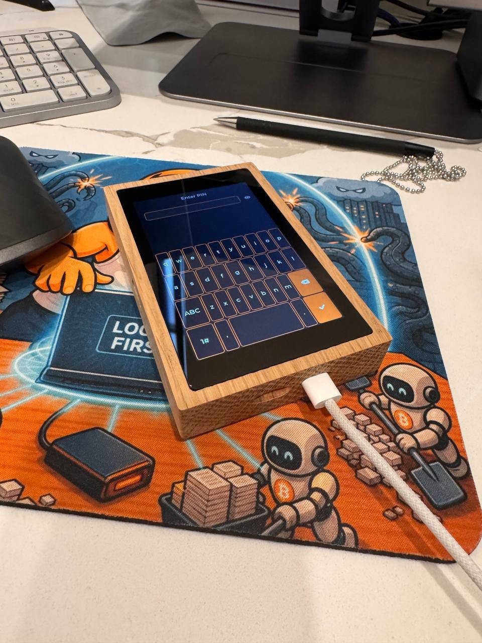 The Kern touchscreen running inside the finished elm tray with a USB-C cable attached.