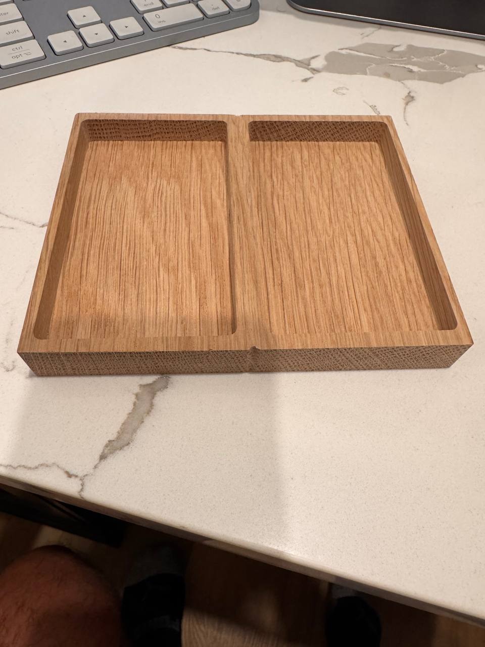 A wide piece of elm CNC-milled with two side-by-side pockets for two touchscreen devices.